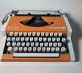 Vintage alte Schreibmaschine Olympia Traveller de Luxe orange typewriter 70er