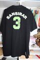 Sansibar Poloshirt, Größe L, schwarz mit grünen Applikationen